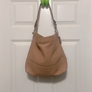 Beautiful like new leather coach purse in great condition .